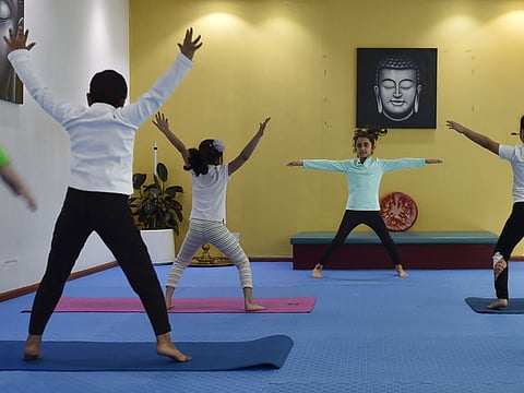 The world's youngest certified yoga instructor, Pranvi Gupta, with her students at Vedic Yoga Centre, Bur Dubai, Dubai, UAE.