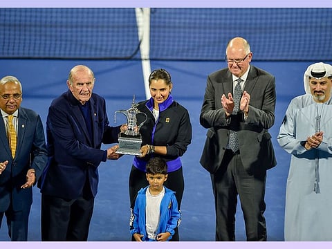 Colm McLoughlin handing over the replica of the women's singles trophy to Sania Mirza , Ramesh Chidambi, Steve Simon and Salah Tahlak watch during the felicitation ceremony at the centre court on Thursday.