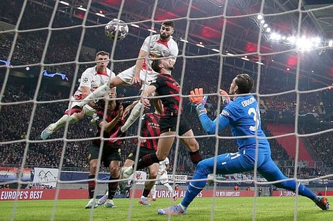 Leipzig's Josko Gvardiol leaps to score the equaliser during the Uefa Champions League round of 16, first-leg against Manchester City.