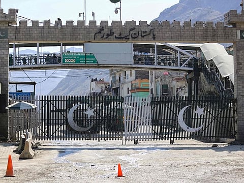 The closed Torkham gate is seen from the zero point at the Torkham border crossing between Afghanistan and Pakistan, in Nangarhar province on February 23, 2023.