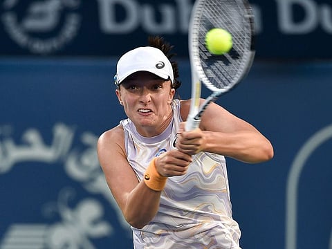 Top seed Iga Swiatek of Poland in action against American Coco Gauff in the semifinals of the Dubai Duty Free Tennis Championship on Friday. Swiatek entered the Dubai final on her third attempt.