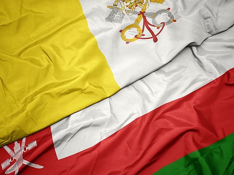 Oman and Vatican flags. The Vatican and Oman have established diplomatic relations, a joint statement said Thursday, three months after a visit by Pope Francis to the Gulf.