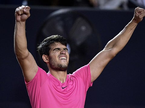 Spaniard Carlos Alcaraz celebrates after winning his ATP 500 Rio Open match against Italy's Fabio Fognini in Rio de Janeiro on Thursday.