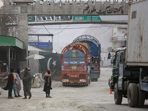 Goods carrier trucks cross into Pakistan at the zero point Torkham border crossing between Afghanistan and Pakistan, in Nangarhar province on February 25, 2023.