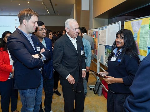 A student explains a project during the event