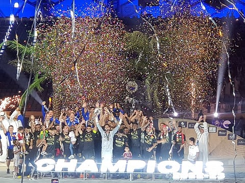 Sharjah FC celebrate with the UAE Super Cup trophy after beating Al Ain 1-0 at Al Maktoum Stadium, Dubai.