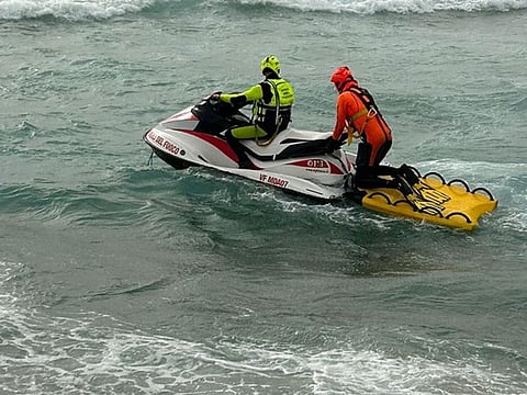 Rescue workers patrol the sea after a deadly migrant shipwreck off the eastern coast of Crotone, Italy.