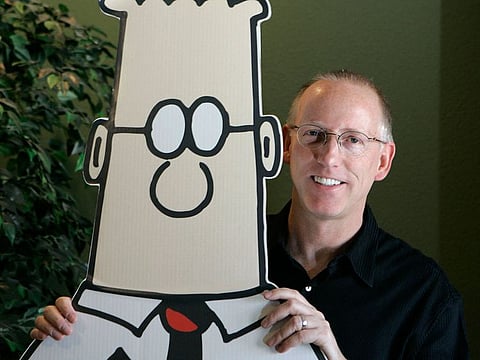 Scott Adams, creator of the comic strip Dilbert, poses for a portrait with the Dilbert character in his studio in Dublin, Calif., Oct. 26, 2006.