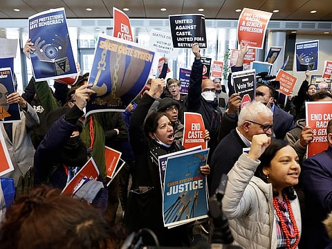Supporters and opponents of a proposed ordinance to add caste to Seattle's anti-discrimination laws protest at a rally at Seattle City Hall, Tuesday, Feb. 21, 2023, in Seattle. Council Member Kshama Sawant proposed the ordinance.