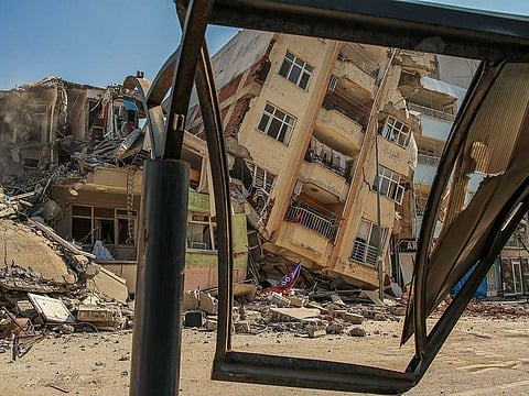 In this file picture, a destroyed building leans on a neighbouring house following the earthquake in Samandag, southern Turkey, Wednesday, Feb. 22, 2023.
