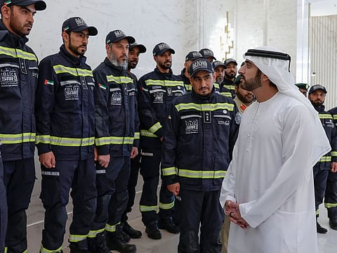 Sheikh Hamdan bin Mohammed bin Rashid Al Maktoum, Crown Prince of Dubai, with members of the search and rescue team of Dubai Police and the Dubai Corporation for Ambulance Services