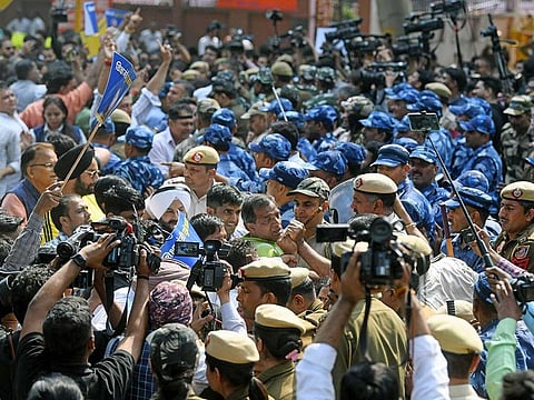 Police and Paramilitary personnel stop Aam Aadmi Party (AAP) supporters during a protest against the arrest of Delhi Deputy Chief Minister Manish Sisodia by CBI, outside AAP Headquarters, in New Delhi on Monday, Feb 27, 2023.