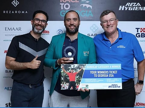 (Left to right) Mishaal Alireza, Hisham Sultan, Division A winner, and Tournament Organiser Keith Watson.