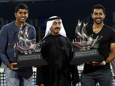 Rohan Bopanna and Aisam-ul-Haq Qureshi with Shaikh Hasher Al Maktoum after winning the 2014 doubles title in Dubai.