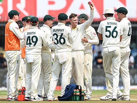 Australia's Matthew Kuhnemann (centre) celebrates with teammates during the first day of the third Test cricket match between India and Australia at the Holkar Stadium in Indore.