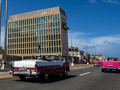 Tourists ride classic convertible cars on the Malecon beside the United States Embassy in Havana, Cuba, Oct. 3, 2017. U.S. intelligence agencies cannot link a foreign adversary to any of the incidents associated with so-called “Havana syndrome,” the hundreds of cases of brain injuries and other symptoms reported by American personnel around the world.