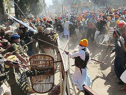 Waris Punab De' group's leader Amritpal Singh's supporters break barricades and enter the police station demanding the release of Amritpal Singh's close aide, in Ajnala near Amritsar