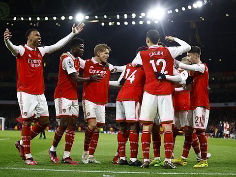 Arsenal's Gabriel Martinelli celebrates after scoring their fourth goal with teammates.