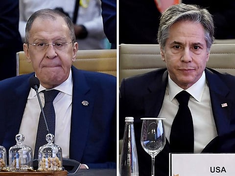 This combination of photos shows US Secretary of State Antony Blinken, right, and Russian Foreign Minister Sergey Lavrov, left, attend the G20 foreign ministers' meeting, respectively, in New Delhi, India, Thursday, March 2, 2023.