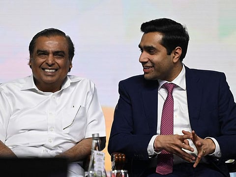 Karan Adani (R), CEO of Adani Ports and SEZ Limited (APSEZ) and Mukesh Ambani, Chairman and Managing Director of Reliance Industries Limited gesture during the opening session of the 'Global Investors Summit 2023' in Visakhapatnam.