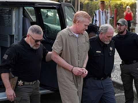 Alex Murdaugh is led to the Colleton County Courthouse by sheriff's deputies for sentencing on March 3, 2023 in Walterboro, S.C., after being convicted of two counts of murder in the June 7, 2021, shooting deaths of Murdaugh's wife and son.