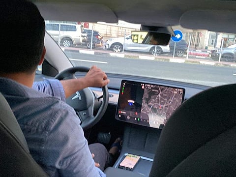 A Tesla Model 3 taxi in the UAE.