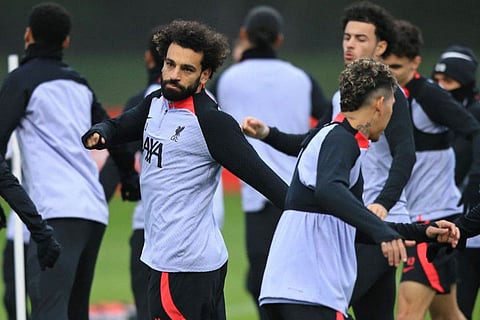 Liverpool's striker Mohamed Salah (left) and teammates take part in a training session at the AXA Training Centre in Liverpool, north-west England on the eve of their Premier League clash against Manchester United.