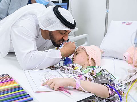 Sheikh Hamdan bin Zayed Al Nahyan, Ruler’s Representative in Al Dhafra Region and Chairman of Emirates Red Crescent, greets a Syrian child recovering at hospital