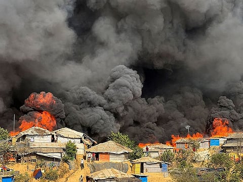 Fire burns in the Rohingya refugee camp in Balukhali in Cox's Bazar, Bangladesh.