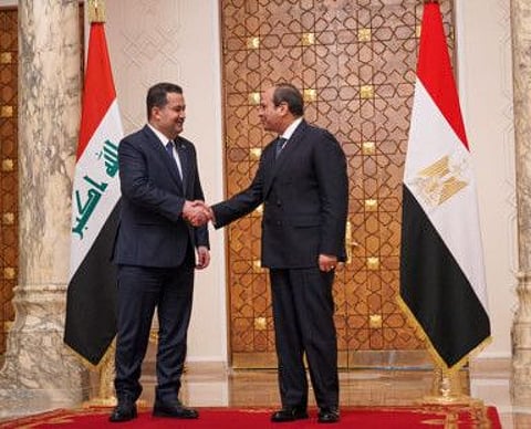 Iraqi Prime Minister Mohammed Shia Al Sudani shakes hands with the Egyptian President Abdel Fattah Al Sissi in Cairo, Egypt, March 5, 2023.