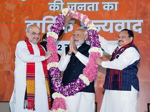Prime Minister Narendra Modi being garlanded by Bharatiya Janata Party (BJP) President JP Nadda and Home Minister Amit Shah during a celebration function after the party's victory in the Assembly polls in three northeastern states of Tripura, Meghalaya and Nagaland
