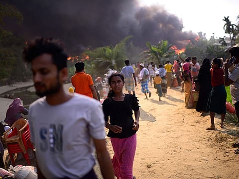 Rohingya refugees try to salvage their belongings after a major fire in their Balukhali camp at Ukhiya in Cox's Bazar district, Bangladesh, earlier this year. A massive fire raced through a crammed camp of Rohingya refugees in southern Bangladesh on Sunday, leaving thousands homeless, a fire official and the United Nations said.