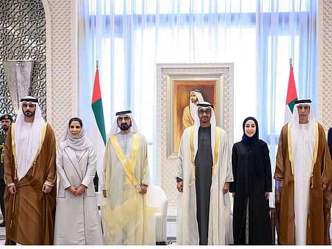 President His Highness Sheikh Mohamed bin Zayed Al Nahyan (third from right) and His Highness Sheikh Mohammed bin Rashid Al Maktoum (fourth from right), with the new ministers on Monday