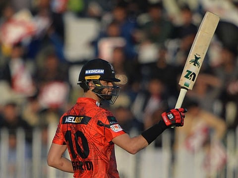 Lahore Qalandars' Shaheen Shah Afridi celebrates a half century during the Pakistan Super League Twenty20 cricket match between Peshawar Zalmi and Lahore Qalandars at the Rawalpindi Cricket Stadium in Rawalpindi.