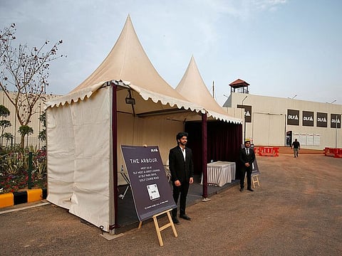 Sales representatives stand outside their kiosks inside a luxury residential project by Indian property developer DLF in Gurugram, India, February 28, 2023.