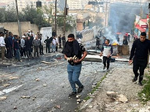 Palestinians clash with Israeli troops during an Israeli army raid in Jenin in the Israeli-occupied West Bank March 7,2023.