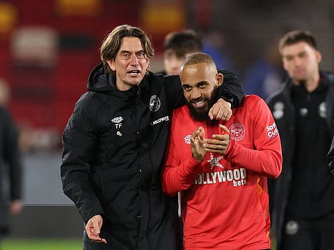 Brentford manager Thomas Frank and Bryan Mbeumo celebrate after the match.