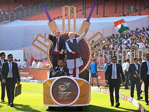 Indian Prime Minister Narendra Modi with his Australian counterpart Anthony Albanese wave as they arrive in the stadium to watch fourth cricket Test between India and Australia in Ahmedabad, India, Thursday, March 9, 2023.