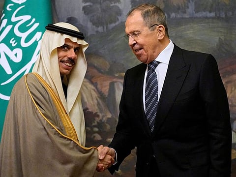 Saudi Arabia's Foreign Minister Prince Faisal bin Farhan Al Saud shakes hands with Russian Foreign Minister Sergei Lavrov during a joint news conference following their talks in Moscow.