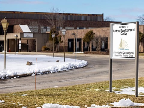A sign for the Monroe Developmental Center at the Finger Lakes Developmental Disabilities Service Office, in Rochester, New York.