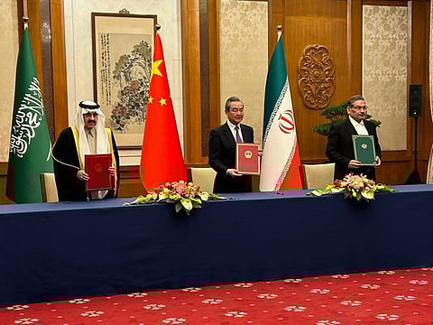 From Left: Saudi national security adviser Musaad bin Mohammad Al Aiban, Wang Yi, China's most senior diplomat, and Ali Shamkhani, secretary of Iran’s Supreme National Security Council, in Beijing.