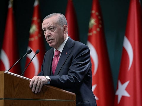 Turkish President Tayyip Erdogan makes a speech after signing the election decision in Ankara on March 10, 2023.