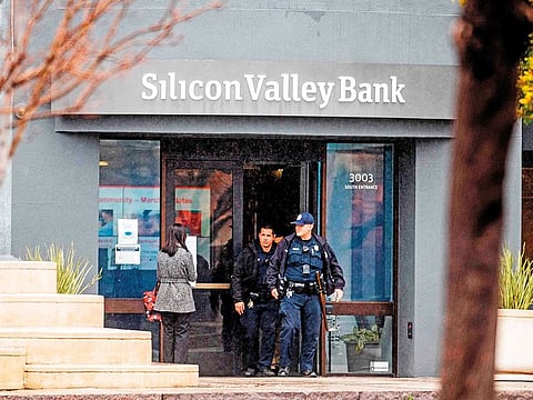 Police officers leave Silicon Valley Bank’s headquarters in Santa Clara, California, on Friday after US authorities swooped in and seized the assets of the key lender to US startups since the 1980s.