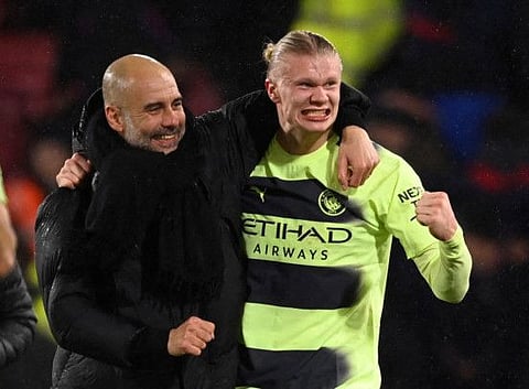 Manchester City manager Pep Guardiola (left) and Erling Haaland celebrate after the match against Crystal Palace at Selhurst Park, London.