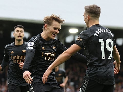 Arsenal's Martin Odegaard celebrates scoring their third goal against Fulham.