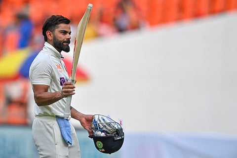 India's Virat Kohli gestures as he walks back to the pavilion after his dismissal during the fourth day of the fourth and final Test against Australia at the Narendra Modi Stadium in Ahmedabad.