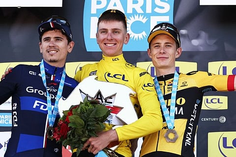 Overall second placed Groupama-FDJ's French rider David Gaudu (left), first placed overall winner UAE Team Emirates' Slovenian rider Tadej Pogacar wearing the overall leader's yellow jersey (centre) and third placed Jumbo-Visma's Danish rider Jonas Vingegaard celebrate on the overall podium after the 8th and final stage of the 81st Paris - Nice cycling race, 117,5 km between Nice and Nice, in French riviera city of Nice, south-eastern France.