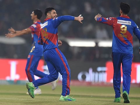 Karachi Kings celebrates the dismissal of Lahore Qalandars Kamran Ghulam (not pictured) during the Pakistan Super League (PSL) Twenty20 cricket match at the Gaddafi Cricket Stadium in Lahore.