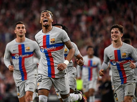 Barcelona forward Raphinha celebrates after scoring during the Spanish league match against Athletic Club Bilbao at the San Mames stadium in Bilbao.