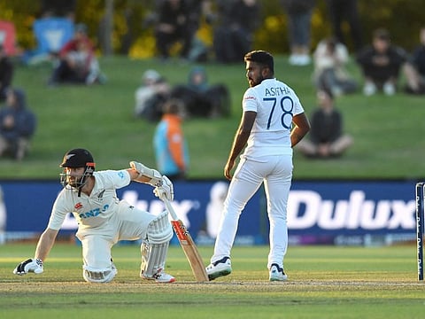 New Zealand's Kane Williamson (left) reacts as Sri Lanka's Asitha Fernando looks on during the fifth day of the first Test at Hagley Oval in Christchurch.
